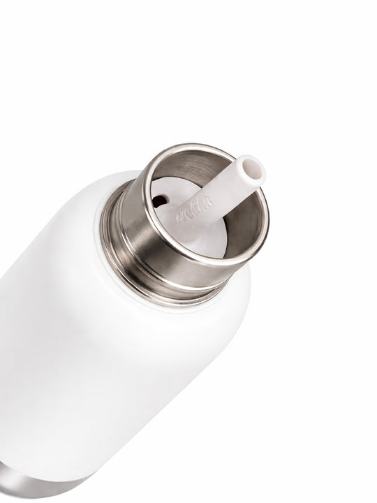 Close-up top view of the Pijo double-wall insulated kids water bottle, showing the stainless steel interior and removable pink silicone straw for easy cleaning.